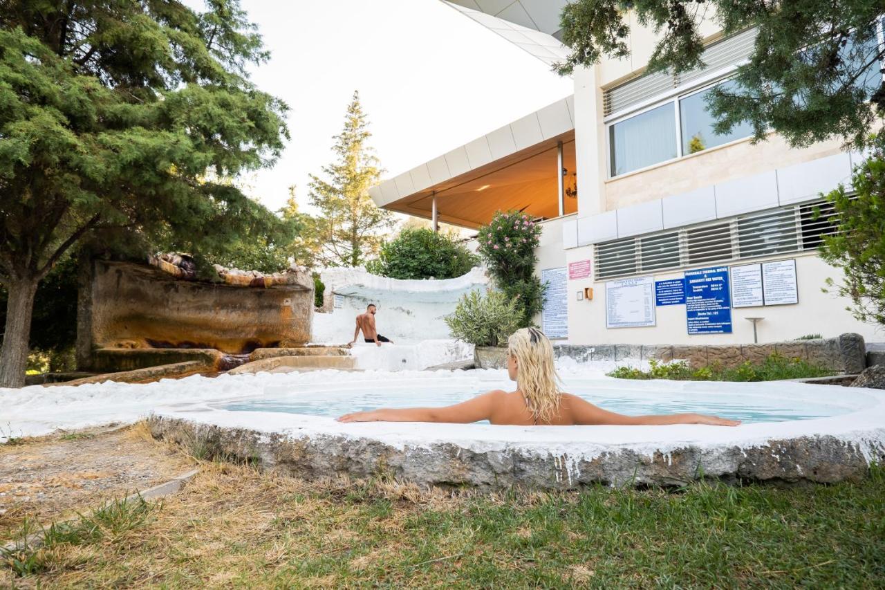 Spa Hotel Colossae Thermal Karahayit  Exterior photo A woman bathing in the thermal waters of the spa